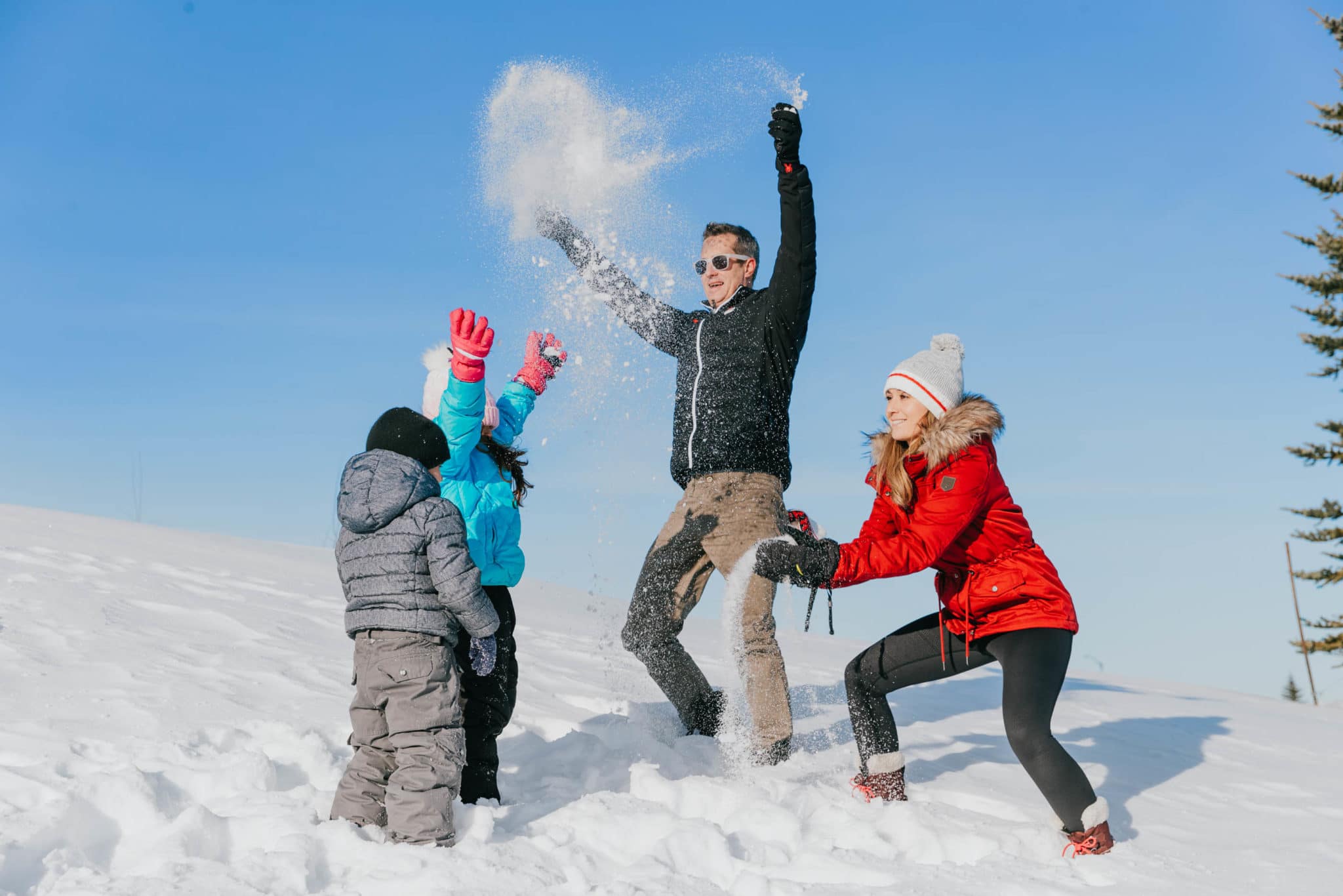 Family playing in the snow